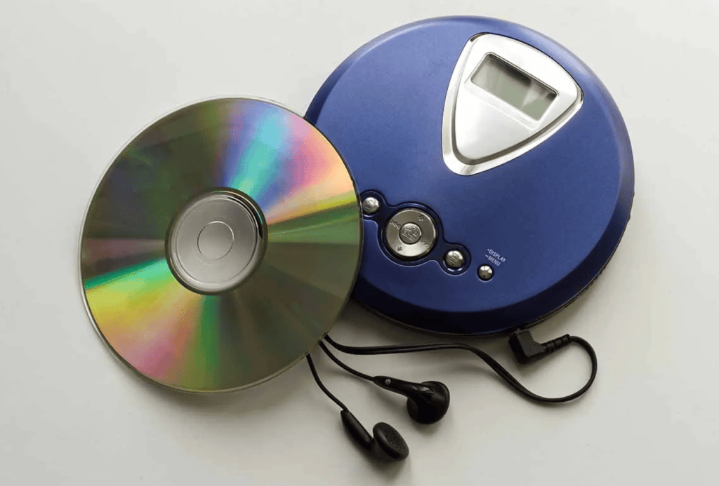 Photo of a CD and a Sony Walkman.